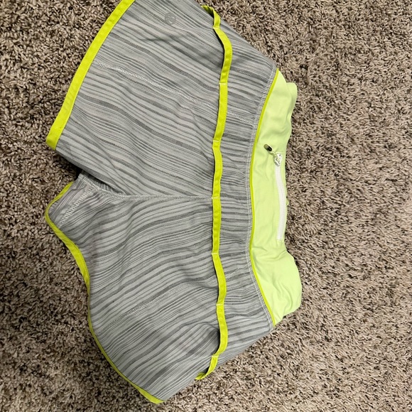 Gray with yellow stitching and waistband Lululemon shorts - Picture 2 of 3